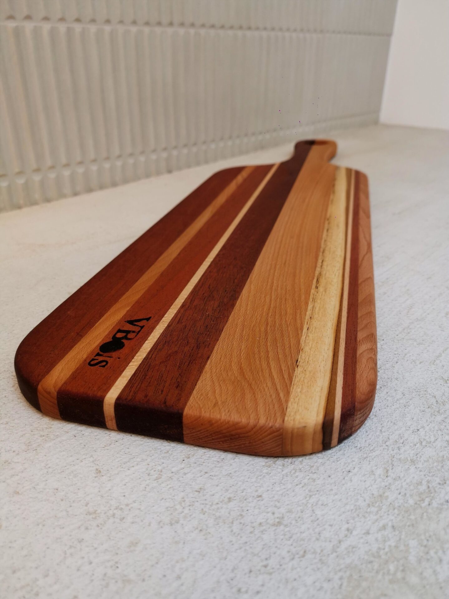Planche apéro en hêtre, sipo et teck 69x19cm